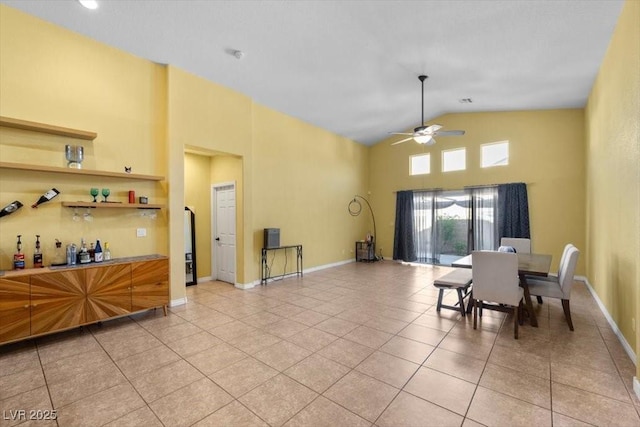 4308 Brazil Palm Ct, North Las Vegas, NV 89032 - dining room featuring light tile patterned flooring, high vaulted ceiling, a ceiling fan, and baseboards