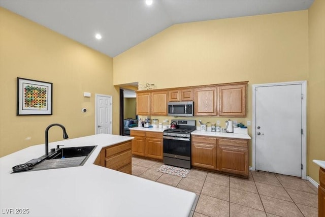 4308 Brazil Palm Ct, North Las Vegas, NV 89032 - kitchen with appliances with stainless steel finishes, high vaulted ceiling, a sink, light countertops, and light tile patterned floors