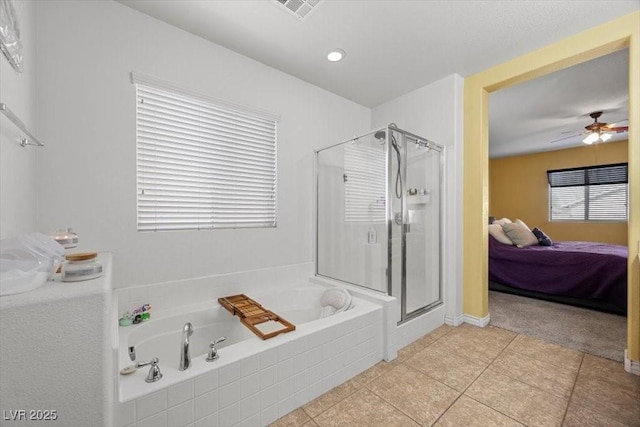 4308 Brazil Palm Ct, North Las Vegas, NV 89032 - bathroom with ensuite bathroom, a bath, a stall shower, ceiling fan, and tile patterned floors