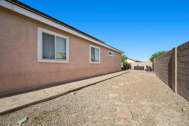 4308 Brazil Palm Ct, North Las Vegas, NV 89032 - view of side of property with stucco siding