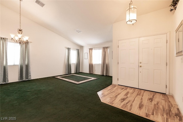 945 Stetson Dr, Henderson, NV 89002 - carpeted foyer with lofted ceiling and a chandelier