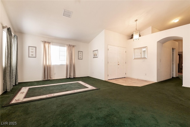 945 Stetson Dr, Henderson, NV 89002 - unfurnished room with carpet flooring, arched walkways, and vaulted ceiling