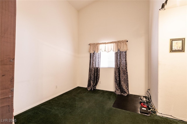 945 Stetson Dr, Henderson, NV 89002 - spare room with dark colored carpet and lofted ceiling