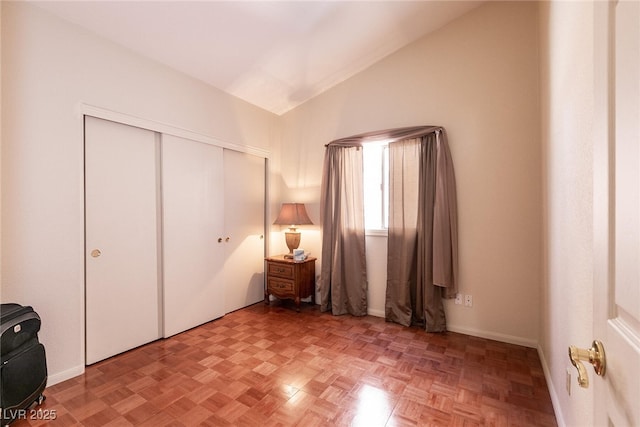 945 Stetson Dr, Henderson, NV 89002 - unfurnished bedroom featuring vaulted ceiling, a closet, and baseboards