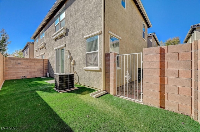 6255 W Arby Ave Unit 258, Las Vegas, NV 89118 - view of side of home with central AC unit, stucco siding, and a gate