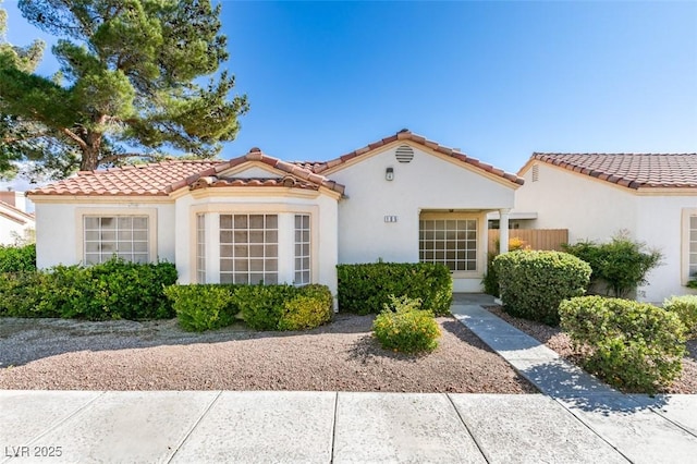 5424 Comchec Way Unit 105, Las Vegas, NV 89108 - mediterranean / spanish-style home featuring stucco siding and a tile roof