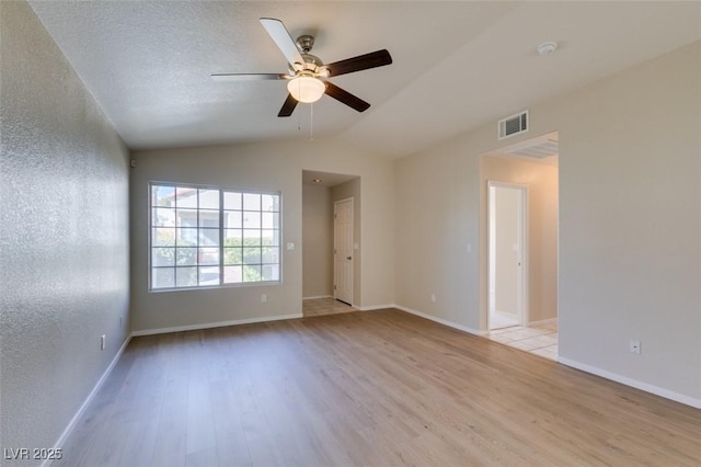 5424 Comchec Way Unit 105, Las Vegas, NV 89108 - empty room featuring light wood-style floors, a ceiling fan, lofted ceiling, and baseboards