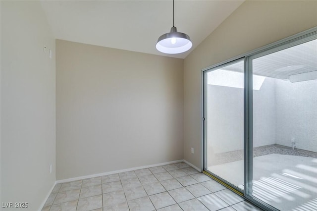 5424 Comchec Way Unit 105, Las Vegas, NV 89108 - empty room with lofted ceiling and light tile patterned floors
