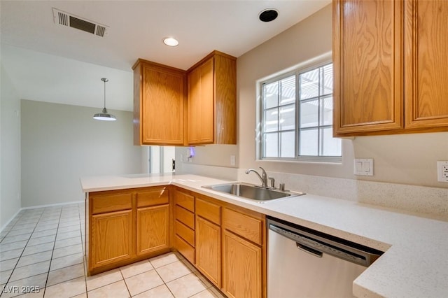 5424 Comchec Way Unit 105, Las Vegas, NV 89108 - kitchen with dishwasher, a sink, a peninsula, light countertops, and light tile patterned floors