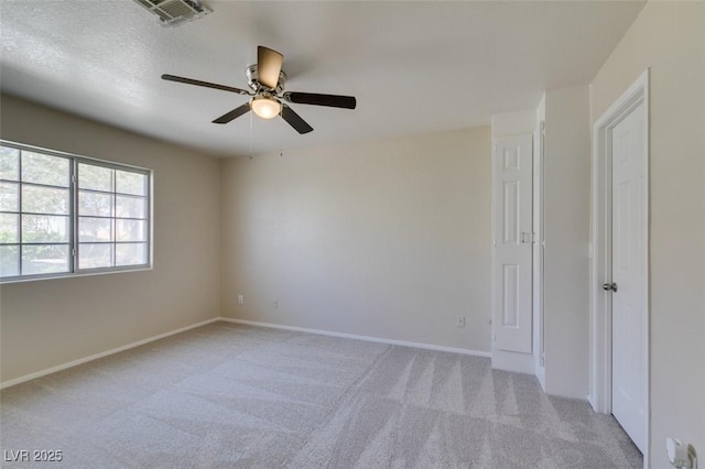5424 Comchec Way Unit 105, Las Vegas, NV 89108 - spare room featuring a ceiling fan, light colored carpet, and baseboards