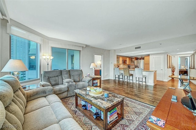 222 Karen Ave Unit 601, Las Vegas, NV 89109 - living room featuring wood finished floors and baseboards