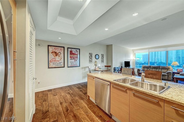 222 Karen Ave Unit 601, Las Vegas, NV 89109 - kitchen featuring dishwasher, a sink, dark wood-style flooring, baseboards, and open floor plan