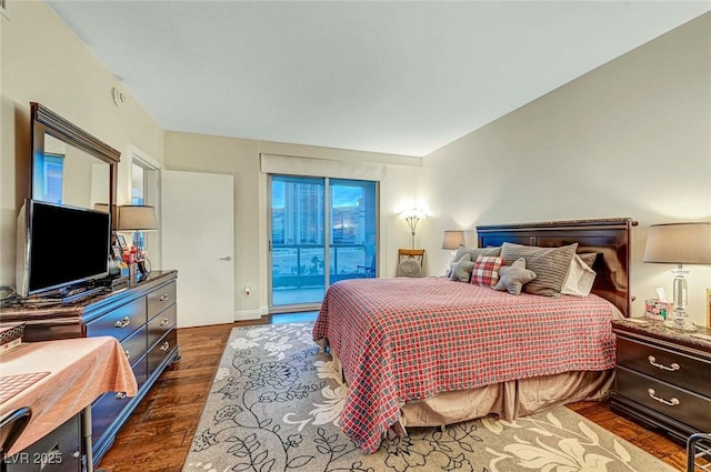 222 Karen Ave Unit 601, Las Vegas, NV 89109 - bedroom with dark wood-style floors, access to exterior, and baseboards