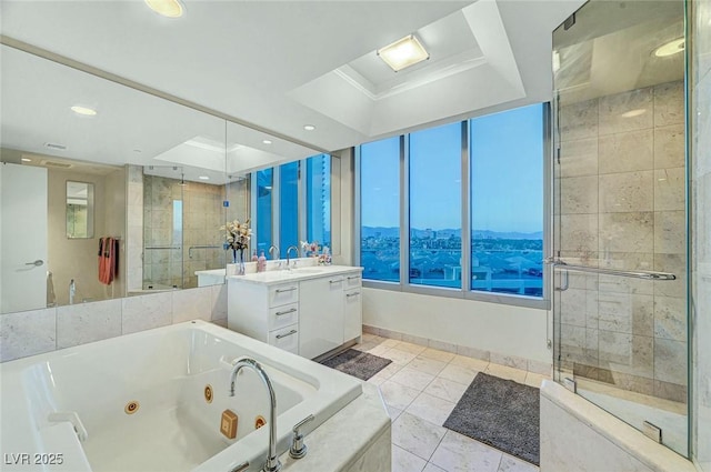 222 Karen Ave Unit 601, Las Vegas, NV 89109 - full bathroom with vanity, a shower stall, a whirlpool tub, recessed lighting, and baseboards