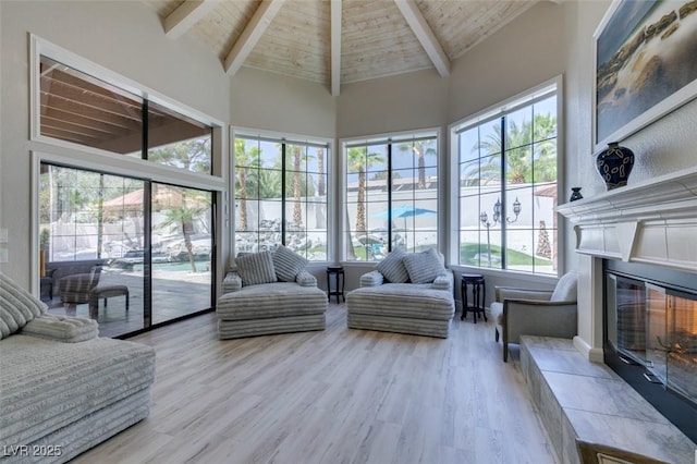 2101 Diamond Bar Dr, Las Vegas, NV 89117 - sunroom featuring high vaulted ceiling, healthy amount of natural light, wood ceiling with exposed beams, and wood finished floors