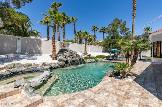 2101 Diamond Bar Dr, Las Vegas, NV 89117 - view of swimming pool featuring a patio area, a fenced backyard, and a pool with connected hot tub