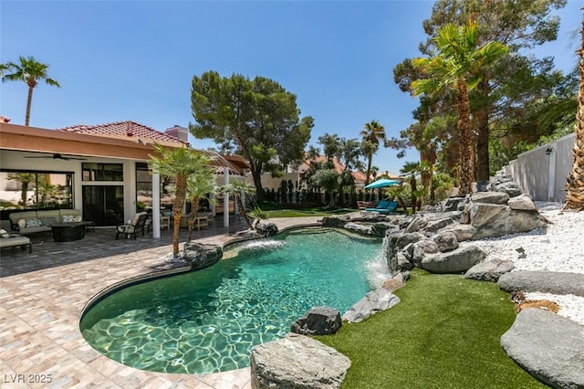 2101 Diamond Bar Dr, Las Vegas, NV 89117 - view of swimming pool with a patio, a ceiling fan, and an outdoor hangout area