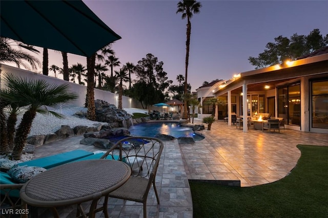 2101 Diamond Bar Dr, Las Vegas, NV 89117 - outdoor pool featuring a patio, a fenced backyard, and an outdoor fire pit