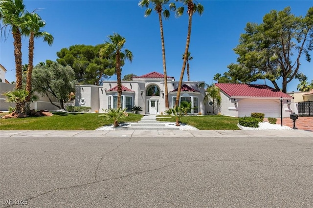 2101 Diamond Bar Dr, Las Vegas, NV 89117 - mediterranean / spanish-style house featuring a front lawn and a tiled roof