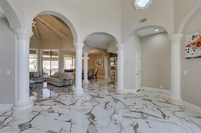 2101 Diamond Bar Dr, Las Vegas, NV 89117 - entryway with high vaulted ceiling, marble tiled floors, and wooden ceiling with exposed beams