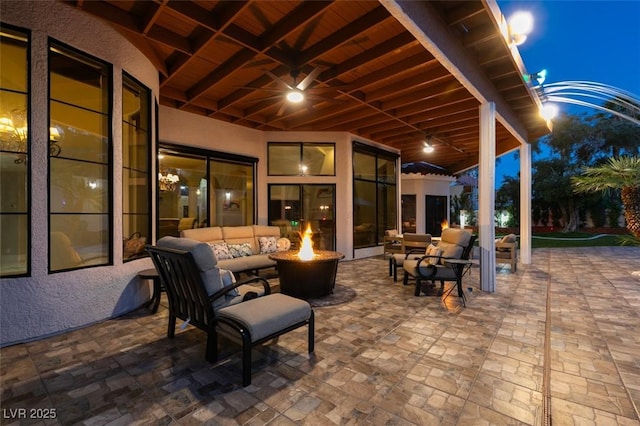 2101 Diamond Bar Dr, Las Vegas, NV 89117 - patio at night featuring an outdoor living space with a fire pit and a patio