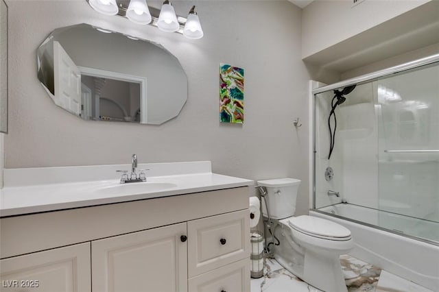 2101 Diamond Bar Dr, Las Vegas, NV 89117 - bathroom with vanity, toilet, marble finish flooring, and combined bath / shower with glass door