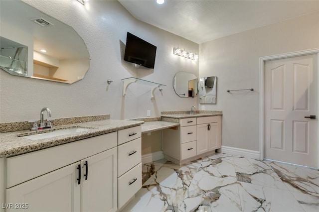 2101 Diamond Bar Dr, Las Vegas, NV 89117 - bathroom featuring baseboards, two vanities, marble look tiles, and recessed lighting