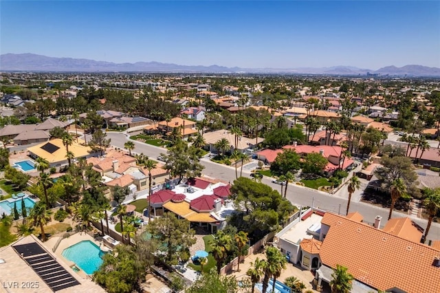 2101 Diamond Bar Dr, Las Vegas, NV 89117 - aerial perspective of suburban area with a pool and mountains