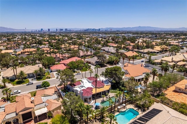2101 Diamond Bar Dr, Las Vegas, NV 89117 - aerial view of residential area with a pool area and a mountainous background