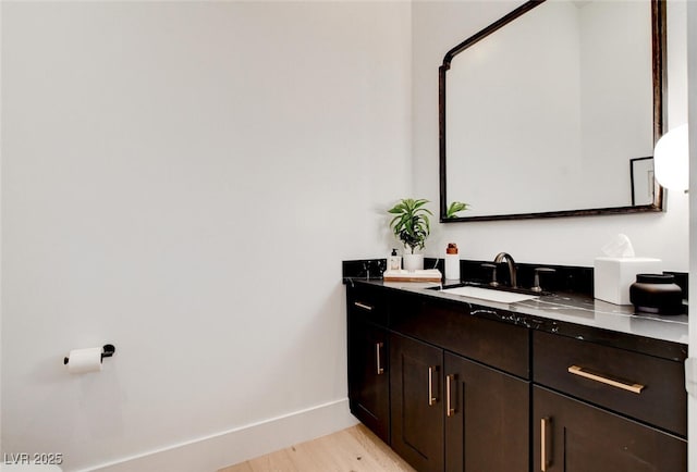 5155 Rock Daisy Dr, Las Vegas, NV 89135 - full bath with double vanity, wood finished floors, and baseboards
