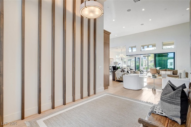 5155 Rock Daisy Dr, Las Vegas, NV 89135 - staircase with a high ceiling, wood finished floors, recessed lighting, and a chandelier