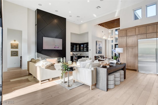 5155 Rock Daisy Dr, Las Vegas, NV 89135 - living area featuring a towering ceiling, light wood finished floors, and recessed lighting