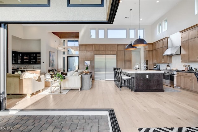 5155 Rock Daisy Dr, Las Vegas, NV 89135 - living room featuring a towering ceiling, light wood-style floors, and recessed lighting