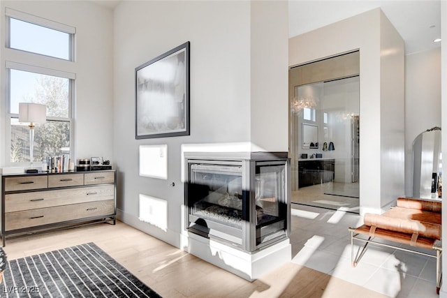 5155 Rock Daisy Dr, Las Vegas, NV 89135 - living area featuring a towering ceiling, baseboards, and arched walkways
