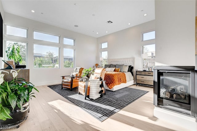 5155 Rock Daisy Dr, Las Vegas, NV 89135 - bedroom featuring multiple windows, wood finished floors, recessed lighting, and baseboards