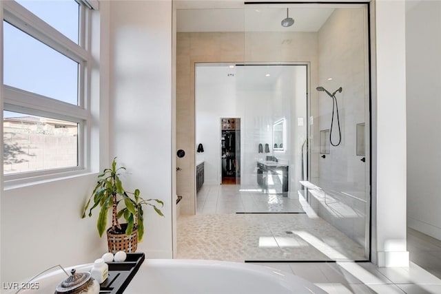 5155 Rock Daisy Dr, Las Vegas, NV 89135 - full bathroom with a tile shower, a tub, tile patterned floors, and baseboards