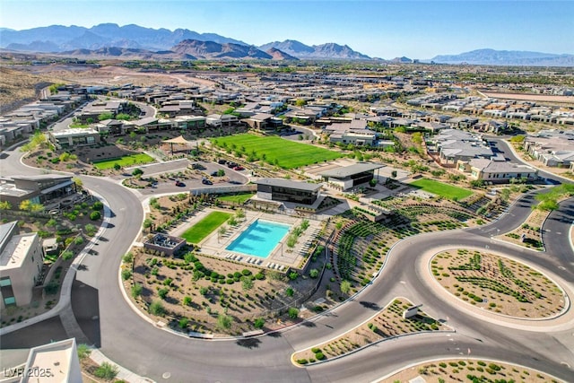 5155 Rock Daisy Dr, Las Vegas, NV 89135 - aerial view of property's location with a mountainous background, a pool area, and nearby suburban area