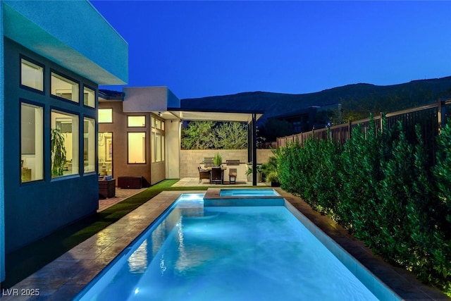 5155 Rock Daisy Dr, Las Vegas, NV 89135 - view of swimming pool with a mountain view, a pool with connected hot tub, and a patio