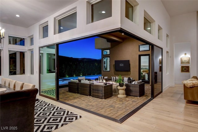 5155 Rock Daisy Dr, Las Vegas, NV 89135 - living area with a high ceiling, wood finished floors, recessed lighting, and a chandelier
