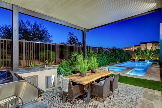 5155 Rock Daisy Dr, Las Vegas, NV 89135 - fenced backyard featuring outdoor dining area, a patio area, and a pool with connected hot tub