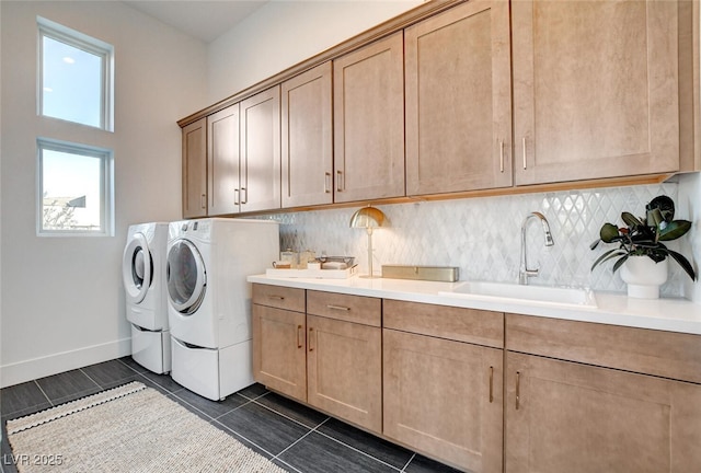 5155 Rock Daisy Dr, Las Vegas, NV 89135 - laundry area featuring cabinet space, washer and clothes dryer, baseboards, and dark tile patterned floors