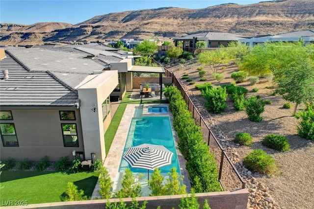 5155 Rock Daisy Dr, Las Vegas, NV 89135 - view of pool featuring a mountain view, a fenced backyard, and a patio