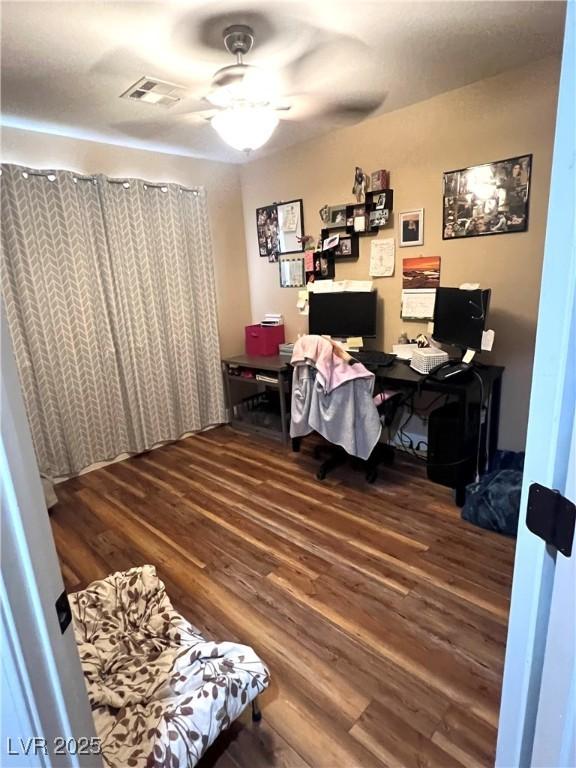 779 Peregrine Falcon St, Henderson, NV 89015 - office area with wood finished floors and ceiling fan