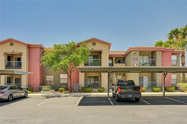 8000 Badura Ave Unit 1007, Las Vegas, NV 89113 - view of building exterior featuring covered and uncovered parking