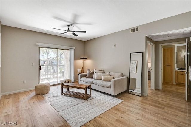 8000 Badura Ave Unit 1007, Las Vegas, NV 89113 - living room featuring a ceiling fan and light wood-style flooring