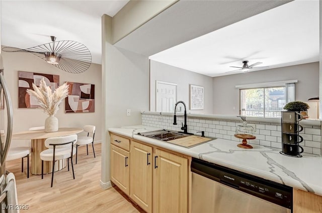 8000 Badura Ave Unit 1007, Las Vegas, NV 89113 - kitchen with dishwasher, tasteful backsplash, light stone countertops, ceiling fan, and light wood-style flooring