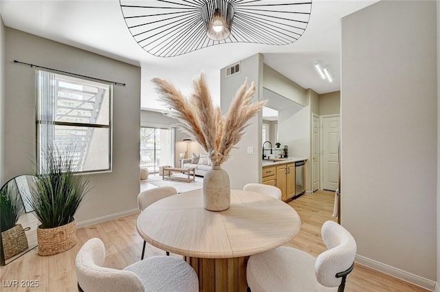 8000 Badura Ave Unit 1007, Las Vegas, NV 89113 - dining space with light wood-style floors and baseboards