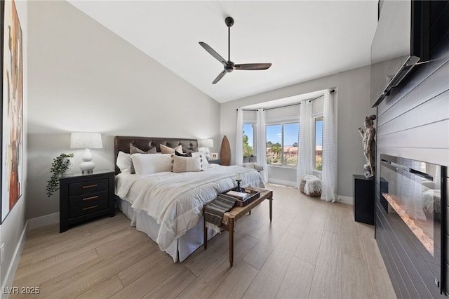 2816 High Range Dr, Las Vegas, NV 89134 - bedroom featuring light wood-type flooring, baseboards, a ceiling fan, and high vaulted ceiling