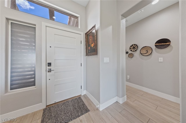 2816 High Range Dr, Las Vegas, NV 89134 - foyer entrance with light wood-style flooring and baseboards