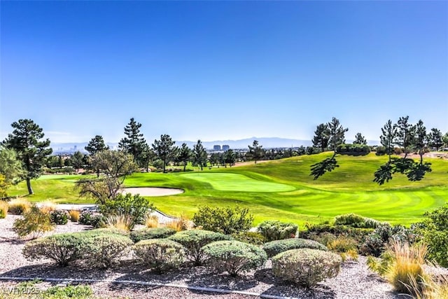 2816 High Range Dr, Las Vegas, NV 89134 - view of home's community with golf course view, a mountain view, and a lawn
